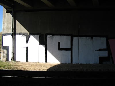White and Black Stylewriting by kafor and KCF. This Graffiti is located in Bitterfeld, Germany and was created in 2006. This Graffiti can be described as Stylewriting, Roll Up and Line Bombing.