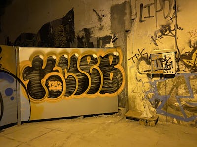 Black and Orange Stylewriting by KNEB. This Graffiti is located in Cyprus and was created in 2022. This Graffiti can be described as Stylewriting, Street Bombing and Throw Up.