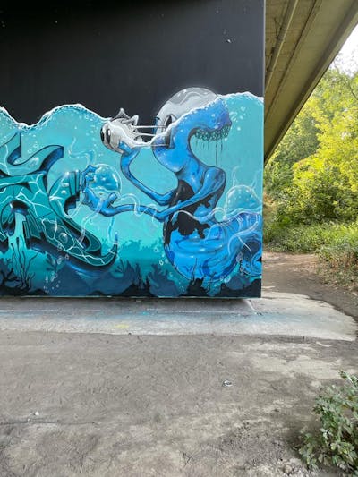 Light Blue Characters by Gaps and Diro. This Graffiti is located in Leipzig, Germany and was created in 2022. This Graffiti can be described as Characters and Murals.