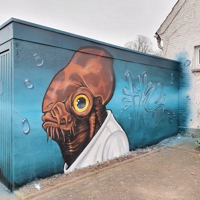 Cyan and Brown Stylewriting by Fiks and MicRoFiks. This Graffiti is located in Oldenburg, Germany and was created in 2020. This Graffiti can be described as Stylewriting and Characters.