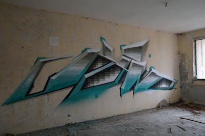 Cyan and Grey Stylewriting by Kan. This Graffiti is located in Leipzig, Germany and was created in 2021. This Graffiti can be described as Stylewriting, Abandoned and Futuristic.