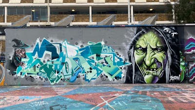 Cyan and Light Green and Grey Stylewriting by Core246, smo__crew and Bjorn. This Graffiti is located in London, United Kingdom and was created in 2022. This Graffiti can be described as Stylewriting, Characters and Wall of Fame.