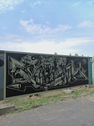 Black and Green Stylewriting by rizok, R120K and bros. This Graffiti is located in Leipzig, Germany and was created in 2021. This Graffiti can be described as Stylewriting and Characters.