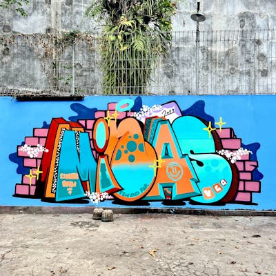 Orange and Light Blue and Coralle Stylewriting by Minas. This Graffiti is located in Yogyakarta, Indonesia and was created in 2022. This Graffiti can be described as Stylewriting and Wall of Fame.