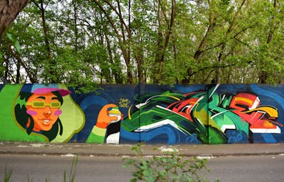 Colorful Stylewriting by Suzie and Coke. This Graffiti is located in Budapest, Hungary and was created in 2023. This Graffiti can be described as Stylewriting, Characters, Wall of Fame and Streetart.