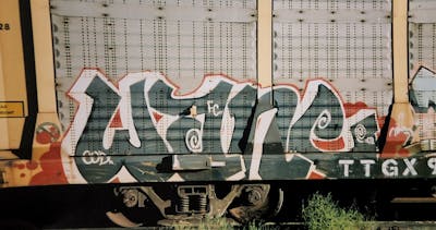 Colorful and Green Stylewriting by Wane. This Graffiti is located in United States and was created in 2009. This Graffiti can be described as Stylewriting, Trains and Freights.