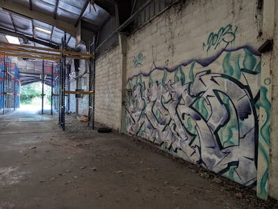 Violet and Cyan Stylewriting by LORD. This Graffiti is located in Caen, France and was created in 2023. This Graffiti can be described as Stylewriting and Abandoned.