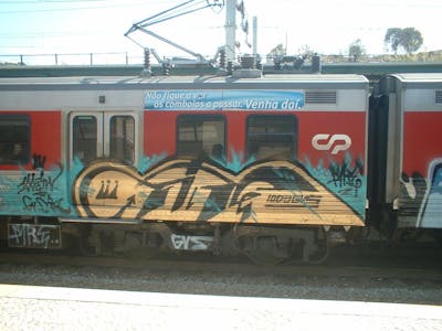 Gold Stylewriting by Fire. This Graffiti is located in Lisboa, Portugal and was created in 2006. This Graffiti can be described as Stylewriting and Trains.