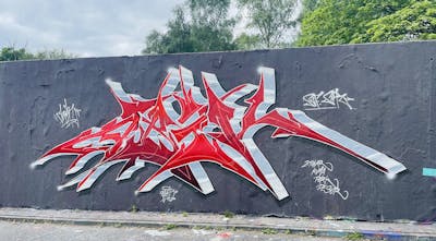 Red and Grey Stylewriting by Abik. This Graffiti is located in Hamburg, Germany and was created in 2022. This Graffiti can be described as Stylewriting and Wall of Fame.