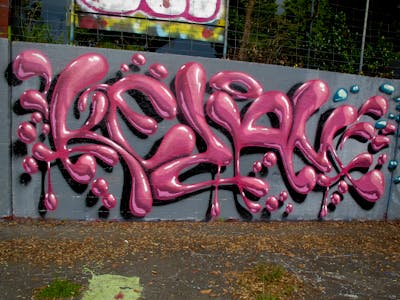 Grey and Coralle Stylewriting by Kezam. This Graffiti is located in Auckland, New Zealand and was created in 2023. This Graffiti can be described as Stylewriting, 3D and Wall of Fame.