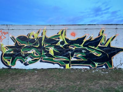 Green and Black Stylewriting by ORES24. This Graffiti is located in Halle, Côte d'Ivoire and was created in 2024.