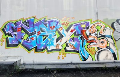 Colorful Stylewriting by ESSEX and TNC. This Graffiti is located in Brisbane, Australia and was created in 2023. This Graffiti can be described as Stylewriting and Characters.