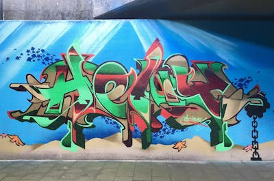 Colorful Stylewriting by Heny and Alfa crew. This Graffiti is located in Dordrecht, Netherlands and was created in 2022. This Graffiti can be described as Stylewriting, Characters and Wall of Fame.
