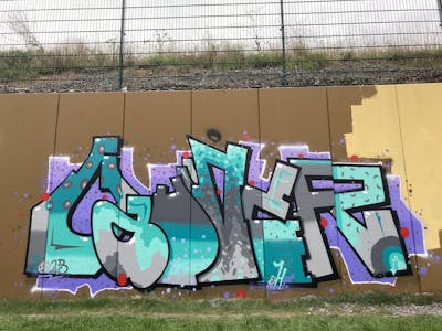 Cyan and Grey and Violet Stylewriting by Gauner. This Graffiti is located in Germany and was created in 2023. This Graffiti can be described as Stylewriting and Wall of Fame.