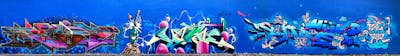 Colorful and Blue Stylewriting by Hülpman, OST, TCK, Bkam, Kims, Bond, Mosha, PÜTK, ESA and EHW. This Graffiti is located in Berlin, Germany and was created in 2021. This Graffiti can be described as Stylewriting, Characters, Murals and Wall of Fame.