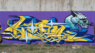 Yellow and Blue Stylewriting by Kotk and NLS CREW. This Graffiti is located in Limassol, Cyprus and was created in 2024. This Graffiti can be described as Stylewriting and Characters.