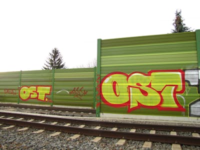 Yellow and Red Stylewriting by urine, mobar, Pizar and OST. This Graffiti is located in Leipzig, Germany and was created in 2016. This Graffiti can be described as Stylewriting and Line Bombing.