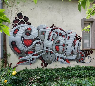 Grey and Red Stylewriting by Shew and the Buddys. This Graffiti is located in Strausberg, Germany and was created in 2022.
