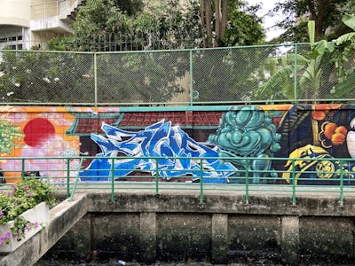 Light Blue and Colorful Stylewriting by Mons and jude juiz. This Graffiti is located in Bangkok, Thailand and was created in 2020. This Graffiti can be described as Stylewriting, Characters, Streetart and Murals.