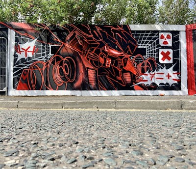 Red and Black Characters by Hyro. This Graffiti is located in Leeds, United Kingdom and was created in 2022. This Graffiti can be described as Characters and Wall of Fame.