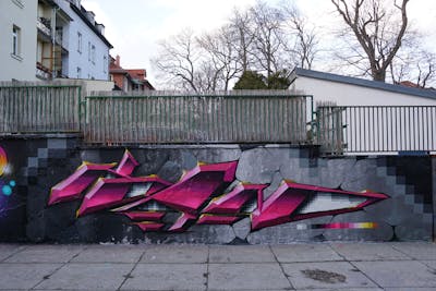 Grey and Violet Stylewriting by TMF and Kan. This Graffiti is located in Erfurt, Germany and was created in 2021. This Graffiti can be described as Stylewriting and Wall of Fame.