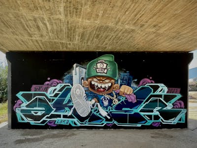 Black and Colorful and Cyan Stylewriting by Aker and Urih. This Graffiti is located in Barcelona, Spain and was created in 2023. This Graffiti can be described as Stylewriting, Characters, Streetart and Blackbook.