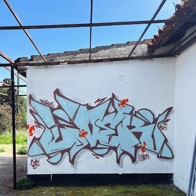 Light Blue Stylewriting by Liver and OSP Crew. This Graffiti is located in Sibenik, Croatia and was created in 2024. This Graffiti can be described as Stylewriting and Abandoned.