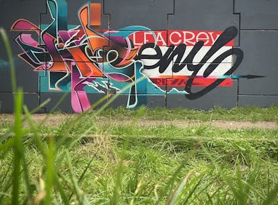 Cyan and Orange and Violet Stylewriting by Heny and Alfa crew. This Graffiti is located in Roosendaal, Netherlands and was created in 2022. This Graffiti can be described as Stylewriting, Wall of Fame and Handstyles.