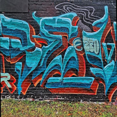 Cyan and Orange Stylewriting by REVES ONE. This Graffiti is located in United Kingdom and was created in 2024.