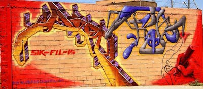 Red and Colorful Stylewriting by sik, fil and urbansoldierz crew. This Graffiti is located in Lleida, Spain and was created in 2004. This Graffiti can be described as Stylewriting, Wall of Fame, Characters and Futuristic.