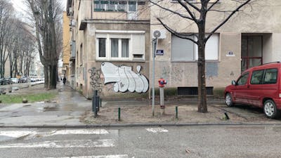 White Roll Up by 7AM. This Graffiti is located in Novi Sad, Serbia and was created in 2024. This Graffiti can be described as Roll Up and Street Bombing.