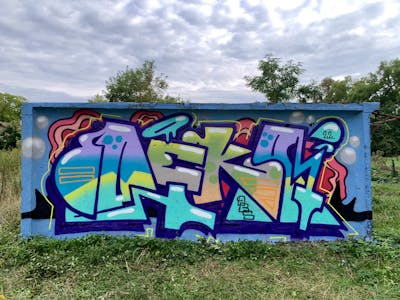Colorful Stylewriting by Deko and D.bros. This Graffiti is located in Hungary and was created in 2022.