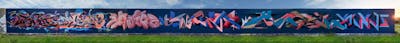 Blue and Coralle and Colorful Stylewriting by Utopia, Hmas, Nostalgic, Plusminusdrei, Bor, Kosmosoliver and Bastique. This Graffiti is located in Germany and was created in 2021. This Graffiti can be described as Stylewriting and Wall of Fame.