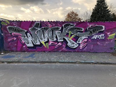 Violet and Grey Stylewriting by WOOKY. This Graffiti is located in Berlin, Germany and was created in 2021. This Graffiti can be described as Stylewriting and Wall of Fame.