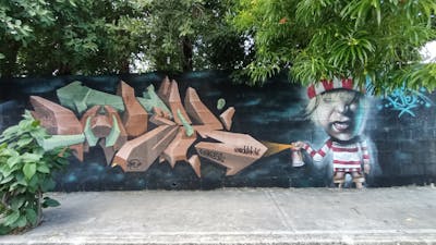 Brown Stylewriting by Panik and Dutek pacheco. This Graffiti is located in Playa del Carmen, Mexico and was created in 2023. This Graffiti can be described as Stylewriting, Characters and 3D.