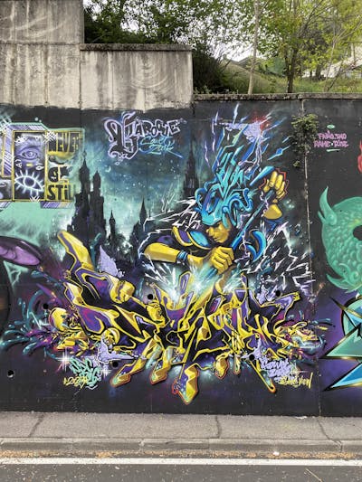 Yellow and Colorful Stylewriting by Zark and Sowet. This Graffiti is located in Sevilla, Italy and was created in 2023. This Graffiti can be described as Stylewriting and Characters.