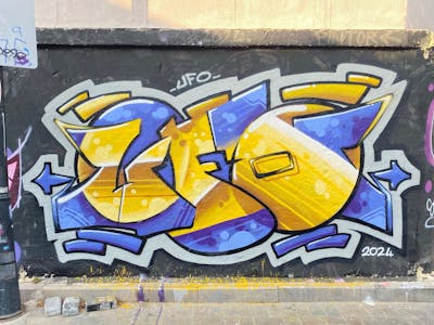 Yellow and Violet Stylewriting by Ufo. This Graffiti is located in Antalya, Turkey and was created in 2024. This Graffiti can be described as Stylewriting and Wall of Fame.