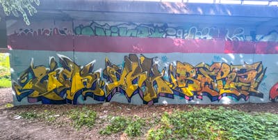 Yellow and Brown and Colorful Stylewriting by ZICK, BERS, PMZ CREW, DRK and ABM Crew. This Graffiti is located in Oldenburg, Germany and was created in 2023. This Graffiti can be described as Stylewriting and Wall of Fame.
