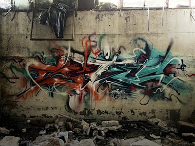 Cyan and Red Stylewriting by CETYS.AGF. This Graffiti is located in Nitra, Slovakia and was created in 2023. This Graffiti can be described as Stylewriting and Abandoned.
