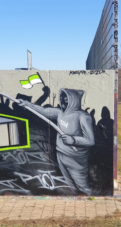 Grey Characters by Riots. This Graffiti is located in Oschatz, Germany and was created in 2022. This Graffiti can be described as Characters and Wall of Fame.