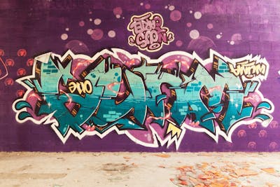 Cyan and Coralle Stylewriting by Wuna. This Graffiti is located in Toulouse, France and was created in 2024.