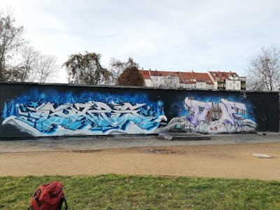 Light Blue and Grey and Violet Stylewriting by Gaps and Chr15. This Graffiti is located in Leipzig, Germany and was created in 2023. This Graffiti can be described as Stylewriting, Wall of Fame and Characters.