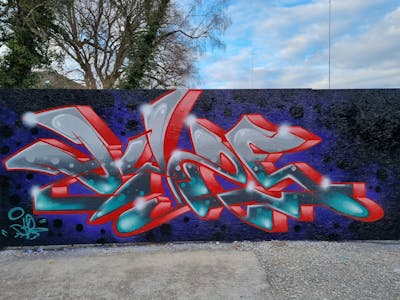 Grey and Red and Colorful Stylewriting by Dyze. This Graffiti is located in Bern, Switzerland and was created in 2024. This Graffiti can be described as Stylewriting and Wall of Fame.