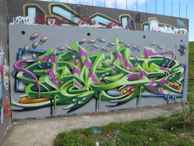 Light Green and Colorful Stylewriting by Kezam. This Graffiti is located in Auckland, New Zealand and was created in 2019. This Graffiti can be described as Stylewriting, 3D and Wall of Fame.