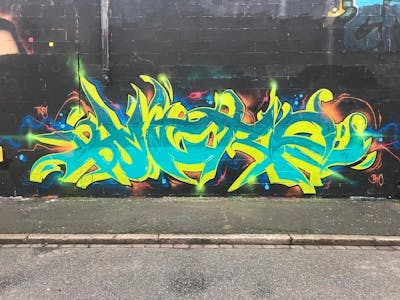 Cyan and Yellow Stylewriting by Micro79. This Graffiti is located in Newcastle, United Kingdom and was created in 2022. This Graffiti can be described as Stylewriting and Wall of Fame.