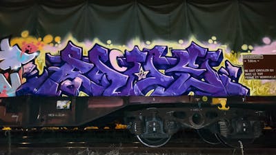 Violet Stylewriting by Angel, DCK, Rave and ALL CAPS COLLECTIVE. This Graffiti is located in Hungary and was created in 2020. This Graffiti can be described as Stylewriting, Freights and Trains.