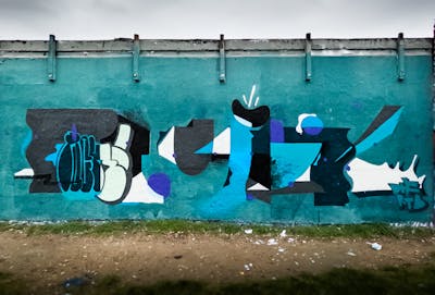 Cyan and Grey Stylewriting by PUCK. This Graffiti is located in cologne, Germany and was created in 2024.