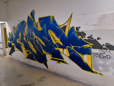 Blue and Yellow Stylewriting by Sewo43. This Graffiti is located in Germany and was created in 2023. This Graffiti can be described as Stylewriting and Abandoned.