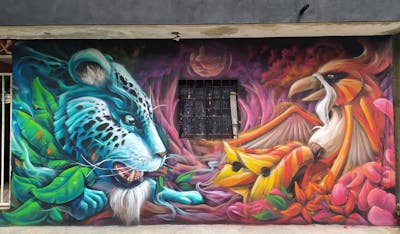 Colorful Characters by Ron-E-Rox. This Graffiti is located in Playa del Carmen, Mexico and was created in 2021. This Graffiti can be described as Characters and Streetart.