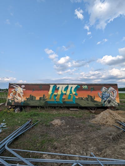 Colorful and Orange Stylewriting by Eksept, Hoar, Hozek and Paynt. This Graffiti is located in Canada and was created in 2023. This Graffiti can be described as Stylewriting, Characters and Cars.